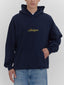 navy hoodie with michigan in yellow script font at front chest